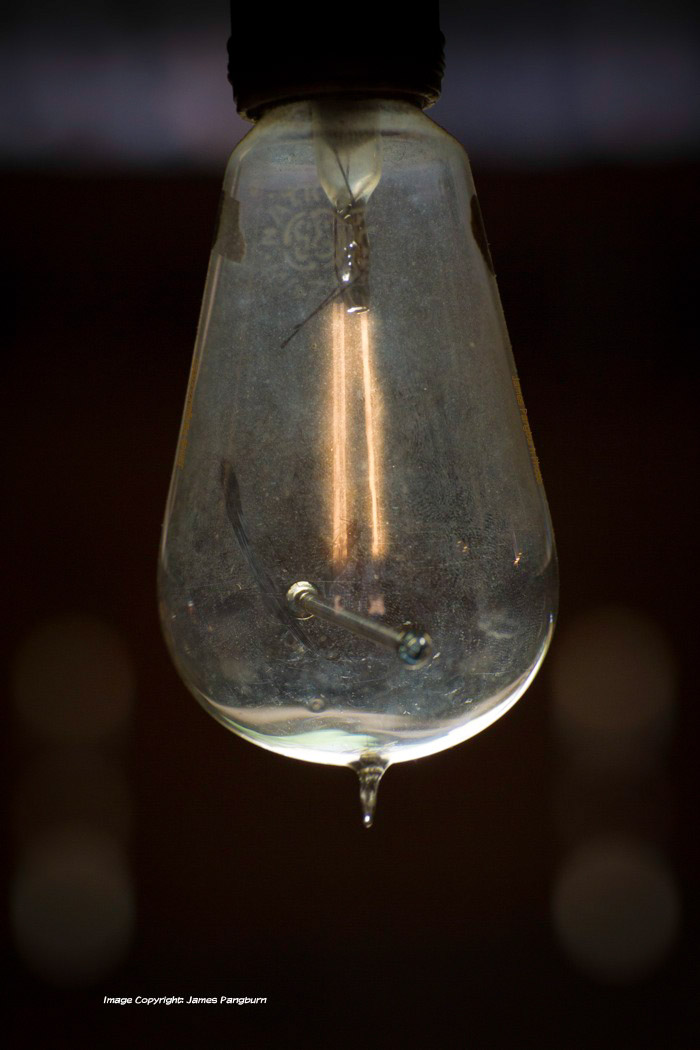 A very old illuminated incandescent lamp