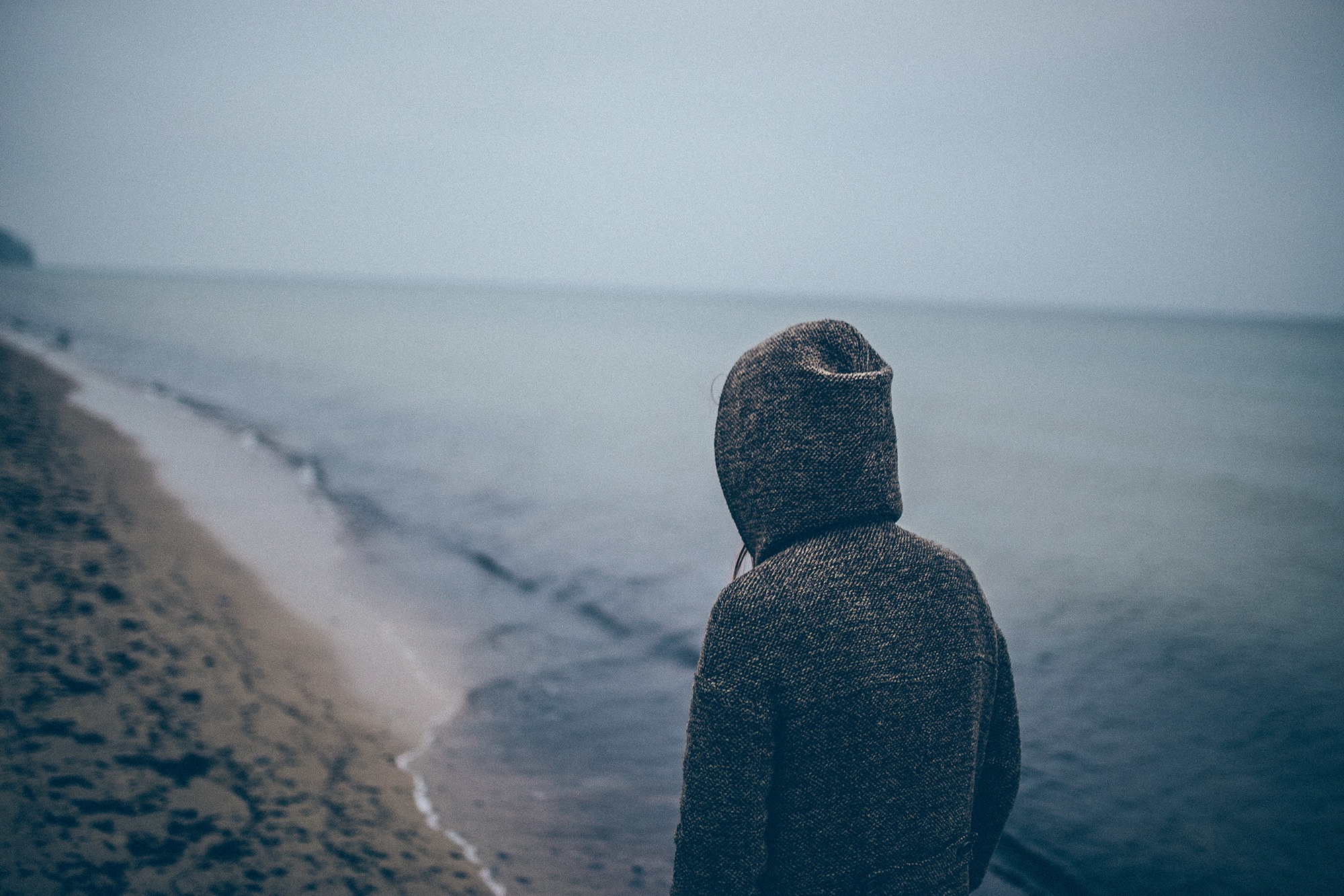 young woman along shoreline