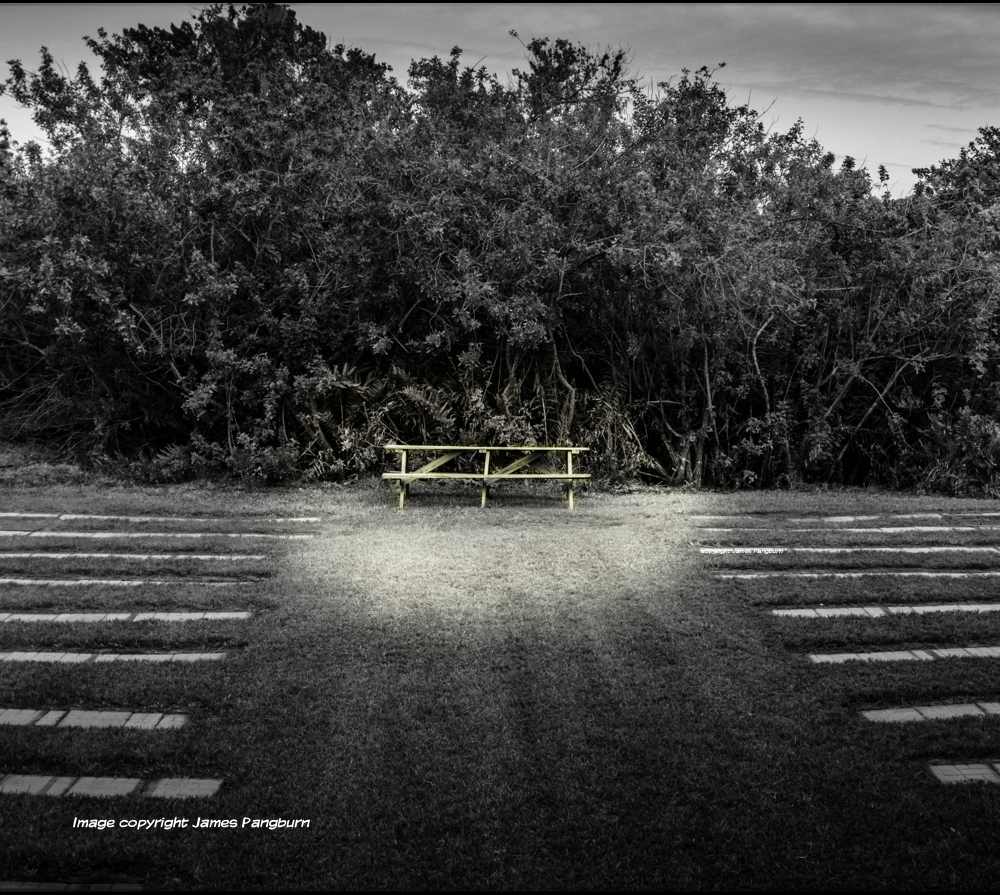 a picnic table offering protection from the wind