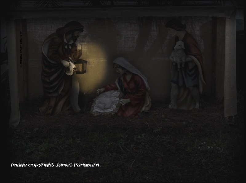 A photo of a manger in darkness