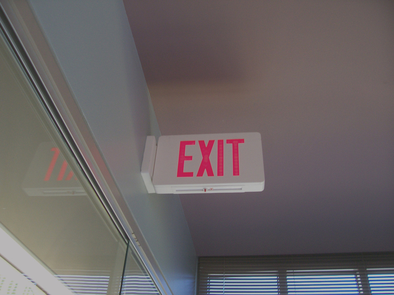 An overhead exit sign showing the way out