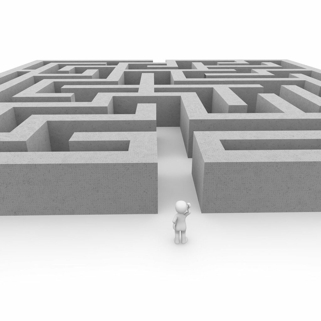 An angled bird's eye view of a gray labyrinth against a white background