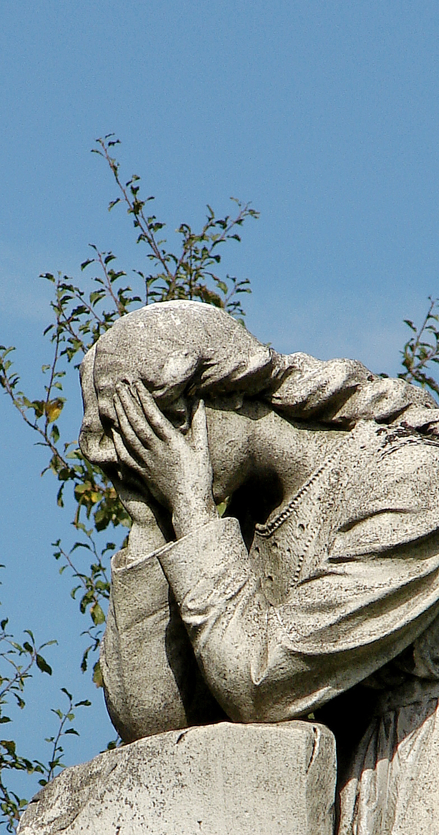 sad statue