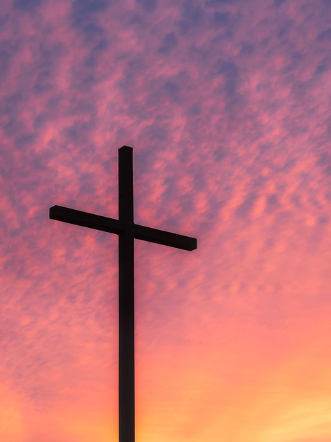 cross with colored sky