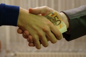 money passed in handshake