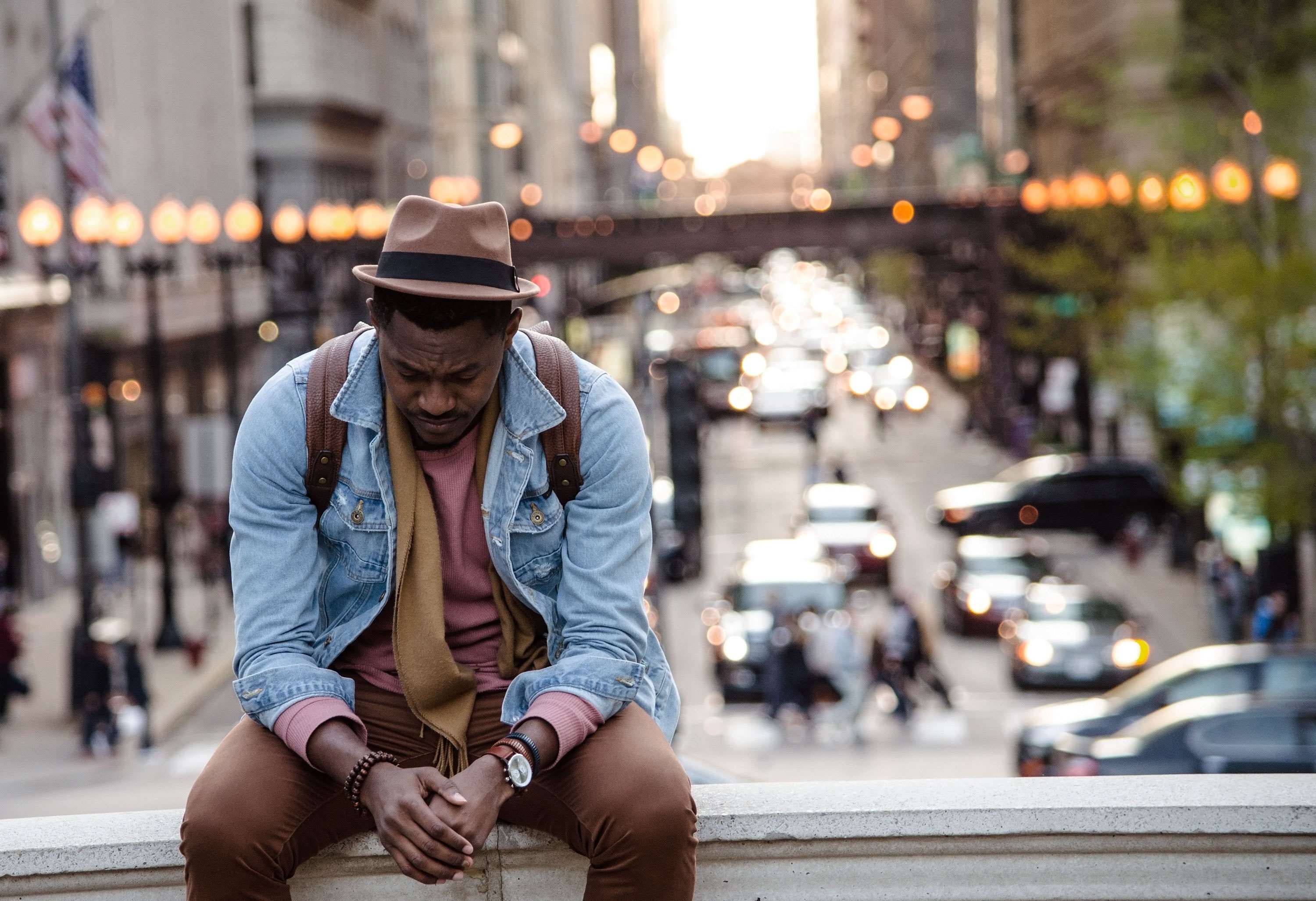 man sitting on ledge