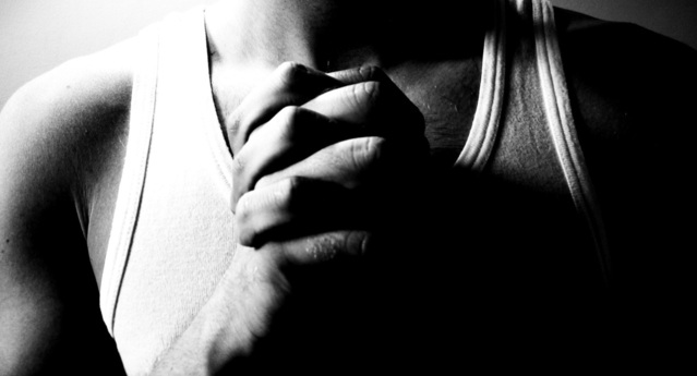 male clasping hands in prayer seeking what does God desire in his life