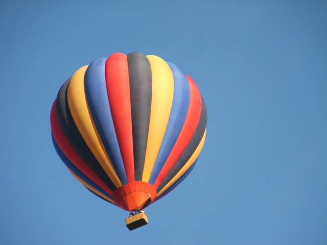 multi-colored balloon floating in sky