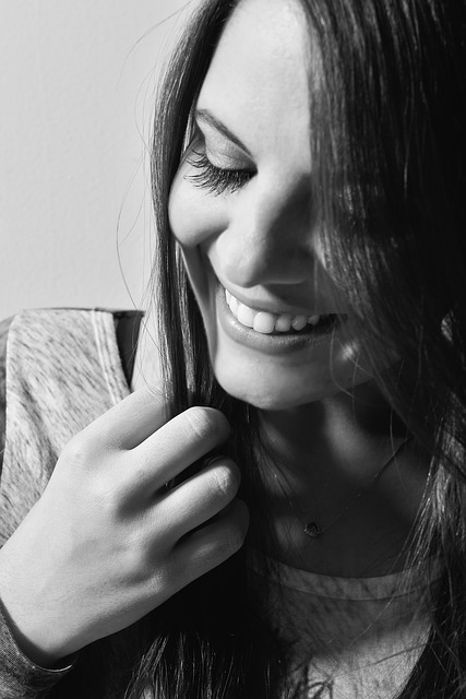 black and white headshot of a happy woman