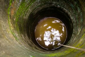 deep-well-pexels-omer-faruq-khan-10553511(https:::www.pexels.com:photo:bucket-lowered-on-rope-into-well-10553511:)