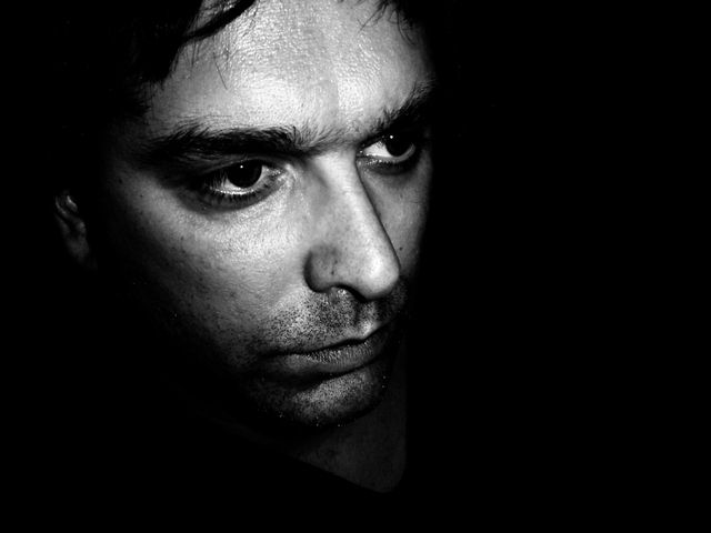 head shot of man with concerned expression and worry