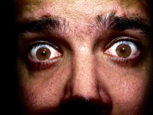 headshot closeup of fearful man