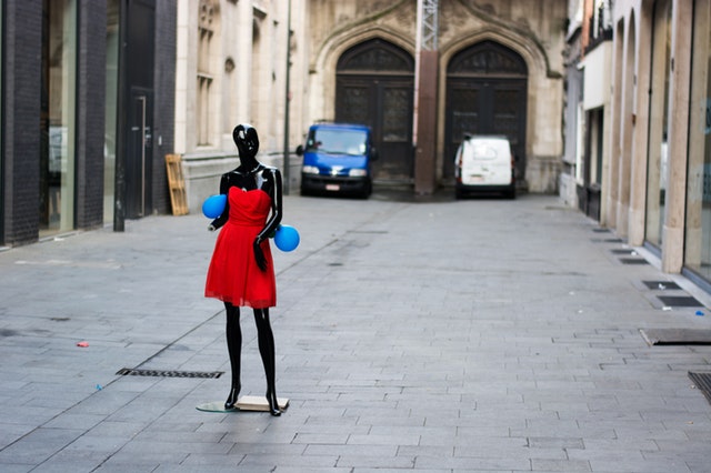black mannequin red dress