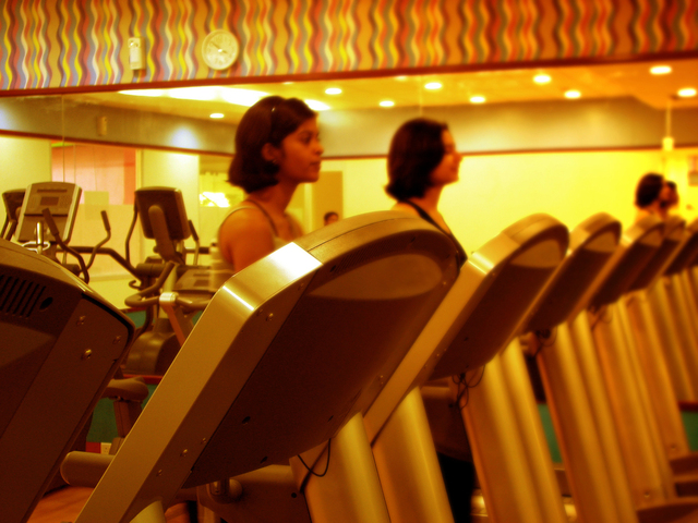 Two women exercising in a modern gym