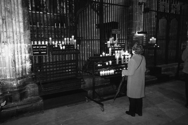 A woman looking at a shrine