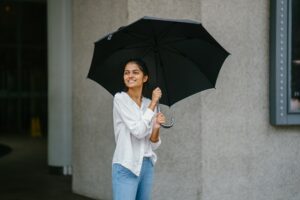 woman smiling with umbrella