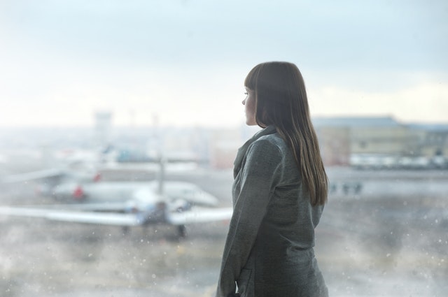 woman looking at planes