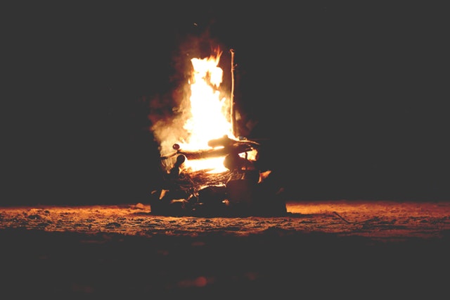 A bonfire at night with large flames