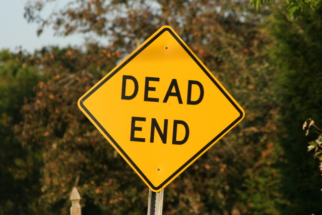 A yellow street sign displaying the words 'dead end.'