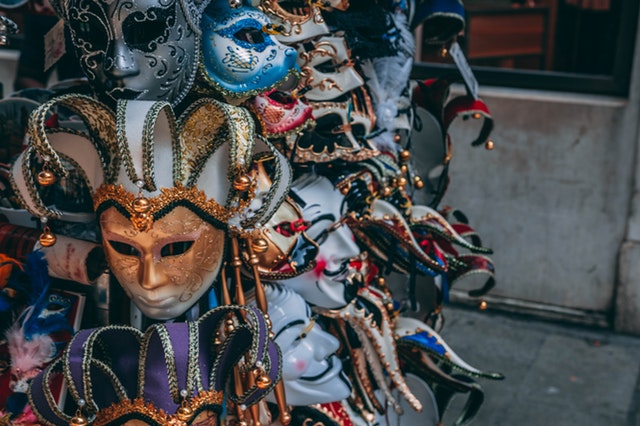 Photo of costume masks hanging on display