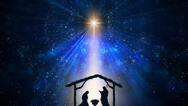graphic image of manger silhouette with star overhead directing a beam over the scene