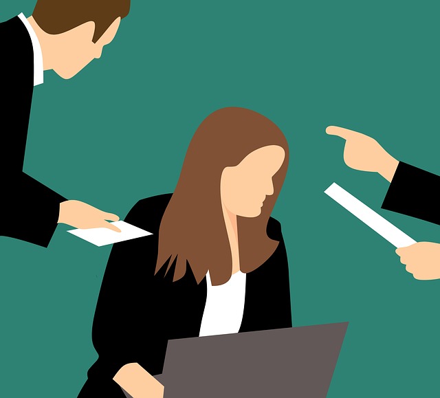 A graphic of a woman being harassed or bullied at work