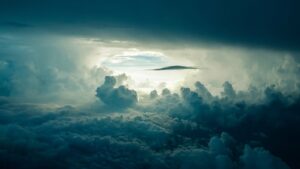 A view of a clear opening in the midst of heavy clouds above and below