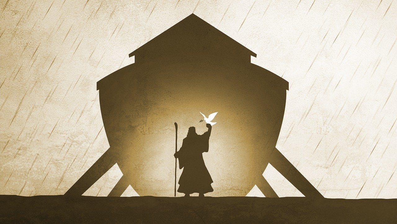 A drawing of Noah's ark in brown looking from the bow end with a lit silhouette of Jesus inside holding a white dove and a staff. The ark is still propped by timbers and rain is falling.