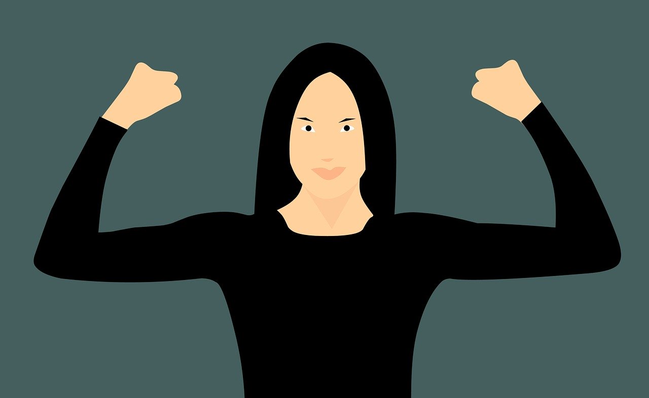 A graphical image of a caucasian woman in black with black hair holding her arms and clenched fists in the air with a serious smile on her face in an attitude of overconfidence.