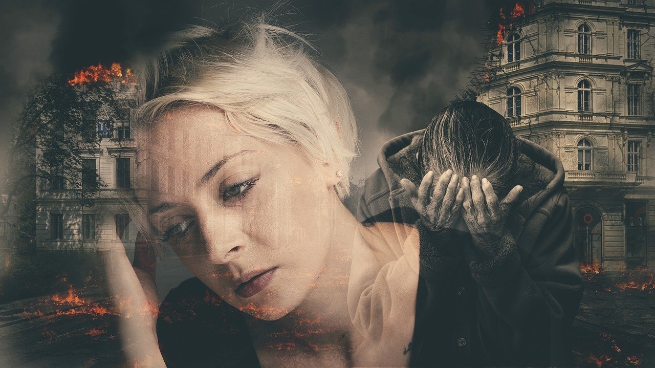 A composite photograph of a middle aged Caucasian woman with white hair and a black shirt leaning toward her raised right hand surrounded by black and white images of old buildings on fire and a older woman wearing a hooded jacket with her head resting in her raised hands symbolic of how life is hard
