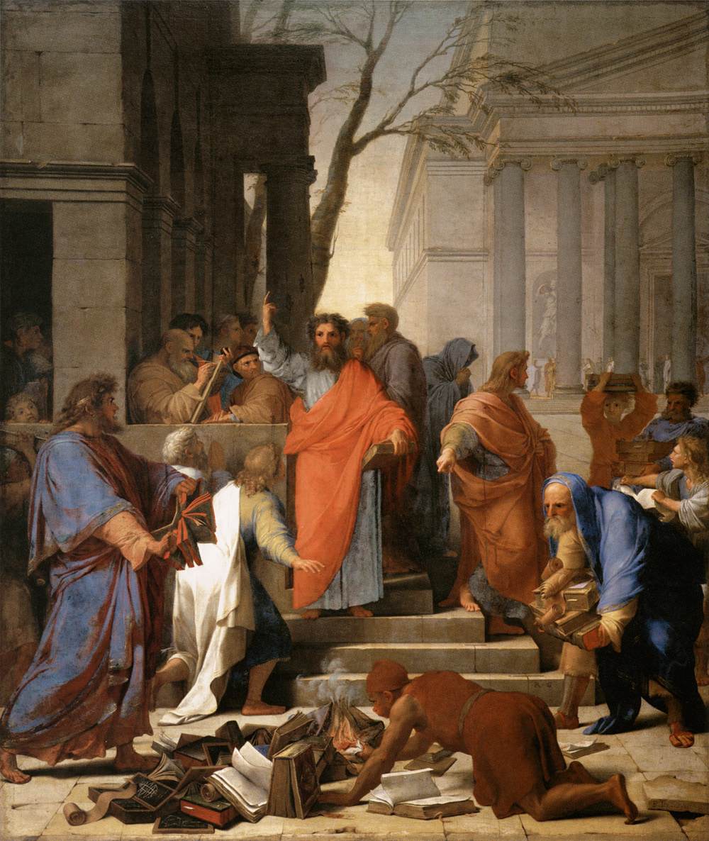A painting of the Apostle Paul, by Eustache Le Suer, standing with an orange tunic, one arm raised and the other holding a book amidst a crowd of assorted individuals and a small pile of books the foreground beginning to be burned