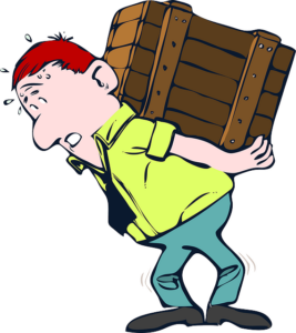 A graphical image of a Caucasian man with red hair, light green shirt, black tie, darker green pants struggling with a large wooden crate on his back