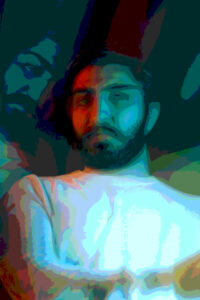 A posterized image of an Asian man with a straight face wearing a white mock turtleneck sweater with his arm fold across it and a partial side reflection of his face