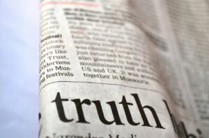 A section of newspaper with emphasis given to the word 'truth' and the rest of the paper out of focus