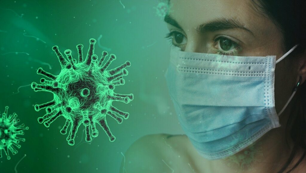 A combined photo of an enlarged image of coronavirus and the headshot of a woman wearing a disposable face mask