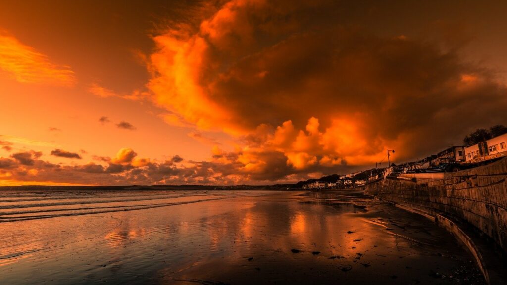A reddish sky with storm clouds approaching in on the right depicting a nation that needs to repent and is on the verge of judgment.