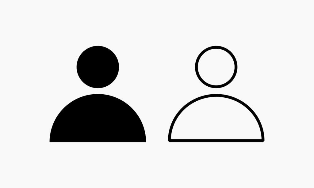 A line drawing of the head and shoulders of two generic persons with one as a black silhouette and the other an outline
