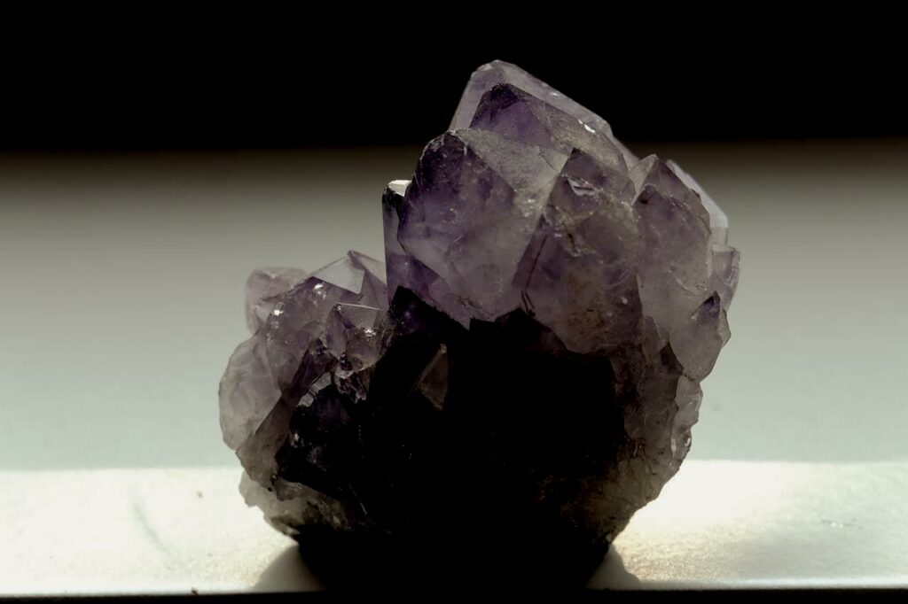 A photo of a piece of amethyst, resting on a counter, that has been darkened