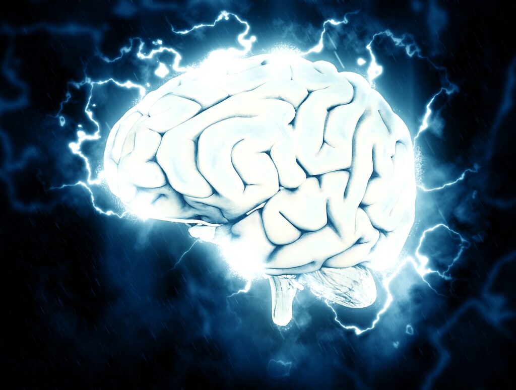 A graphical image of a white brain against a dark navy blue background with electrical sparks emanating from it