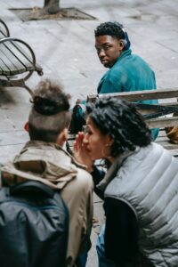gossiping-pexels-keira-burton-6147142(https-::www.pexels.com:photo:ethnic-friends-gossiping-on-yard-of-university-6147142:)