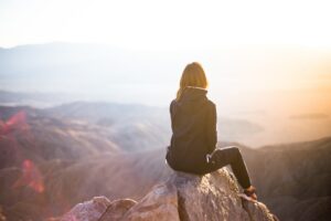 woman-seated-mountain-denys-nevozhai-z0nVqfrOqWA-unsplash(https:::unsplash.com:photos:z0nVqfrOqWA)