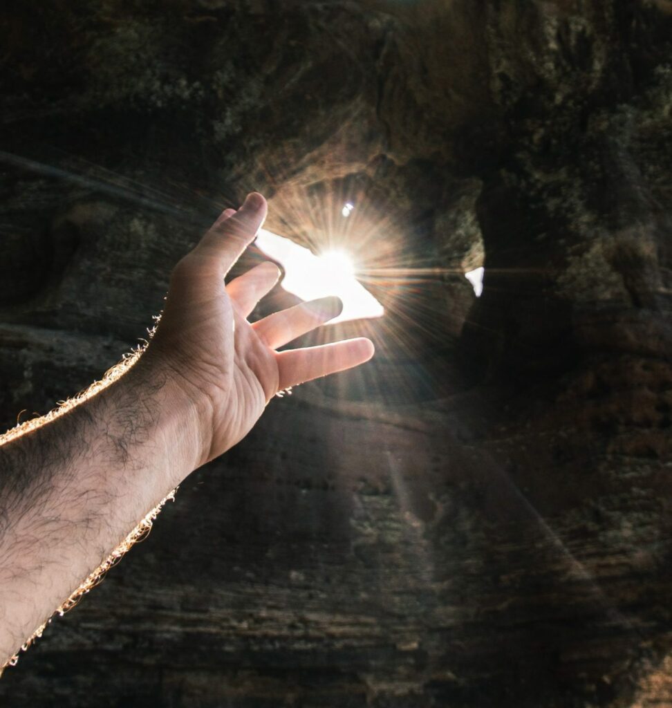 F-hand-reaching-towards-rays-of-sun-daniel-lincoln-MB6nv2Wuq9c-unsplash(https:::unsplash.com:photos:MB6nv2Wuq9c)