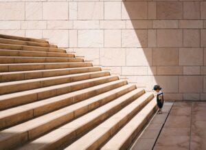toddler-large-concrete-steps-base-jukan-tateisi-bJhT_8nbUA0-unsplash(https-::unsplash.com:photos:toddlers-standing-in-front-of-beige-concrete-stair-bJhT_8nbUA0) cropped