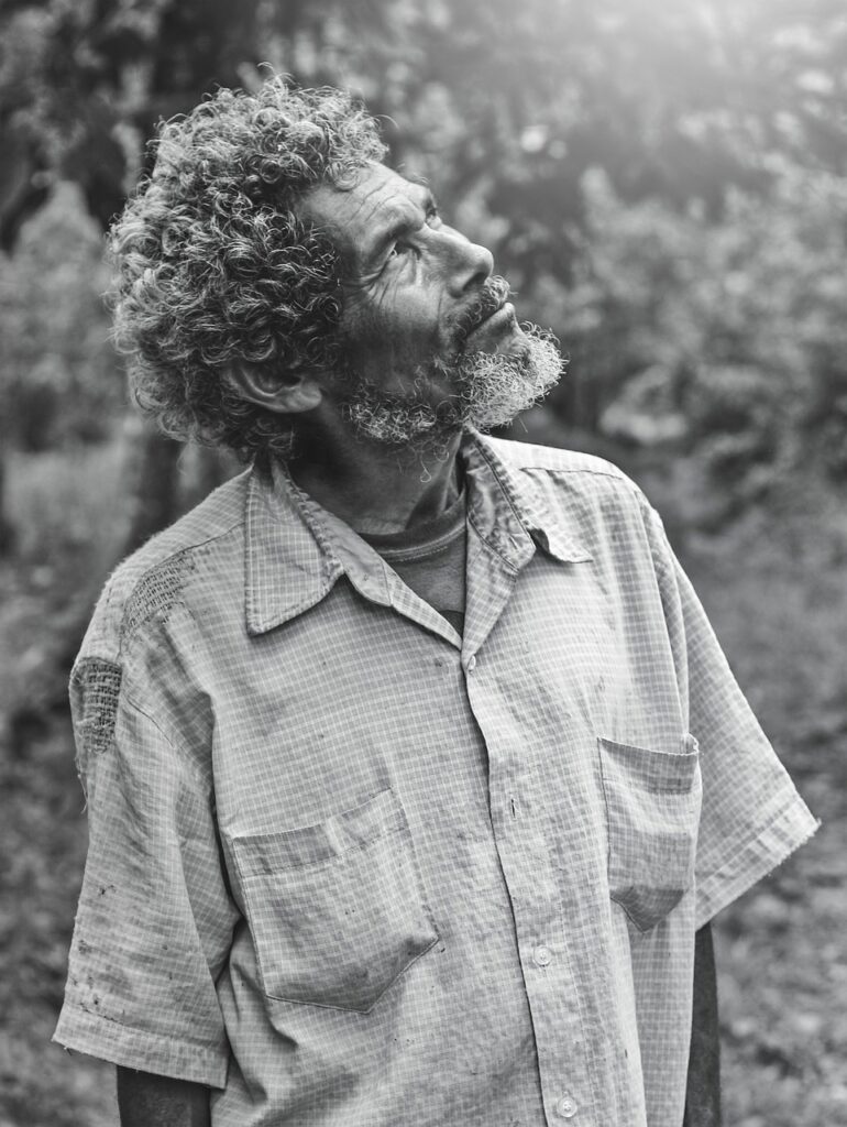 A photo of an older man looking up as though God's voice is calling him