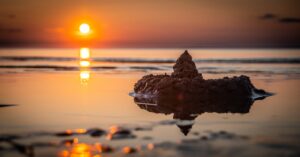 sandcastle-water-sunset-pexels-egor-kamelev-1685504(https-::www.pexels.com:photo:sand-castle-on-seashore-during-golden-hour-1685504:)