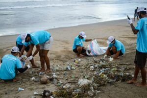 ocg-saving-the-ocean-SIg-qmg9NHw-unsplash(https-::unsplash.com:photos:man-in-teal-t-shirt-and-white-shorts-sitting-on-brown-sand-near-sea-during-daytime-SIg-qmg9NHw)