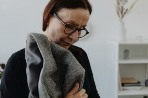 woman-downcast-pexels-karolina-grabowska-8532480(https-::www.pexels.com:photo:an-elderly-woman-in-black-shirt-wearing-eyeglasses-while-holding-a-coat-8532480:)
