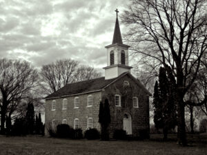 black and white photo of an empty rural church