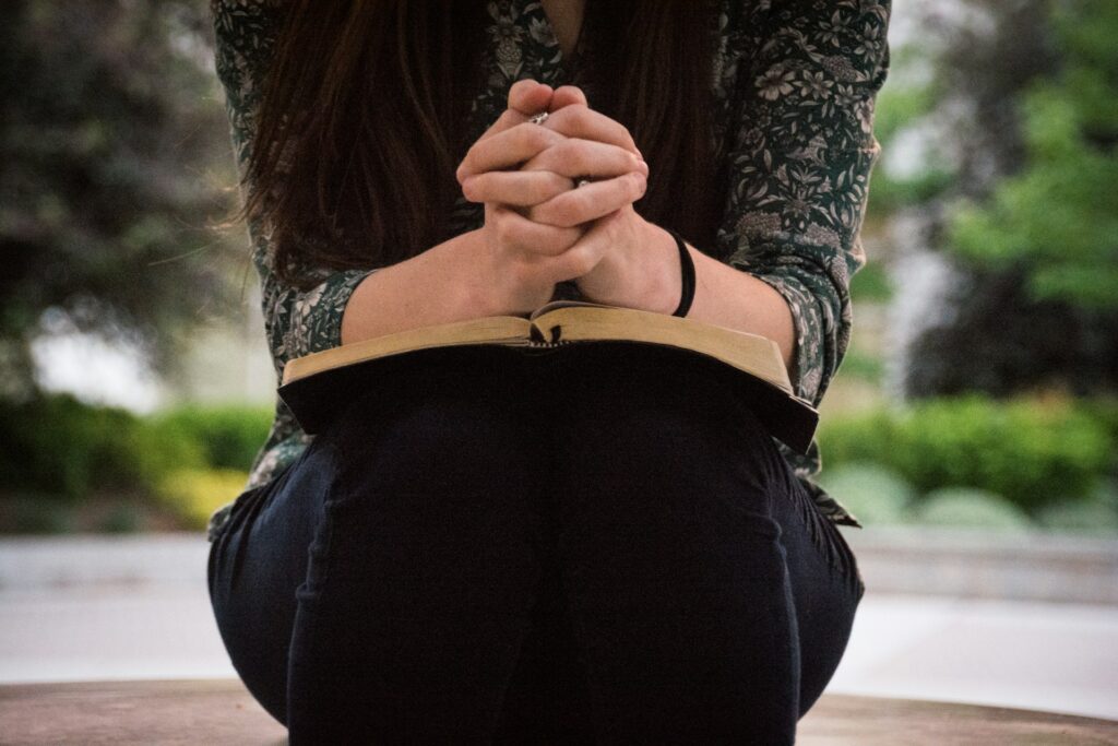 Woman in prayer and surrender to God