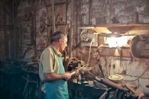 workshop-pexels-olly-3811832(https-::www.pexels.com:photo:photo-of-man-standing-inside-his-workshop-3811832:)